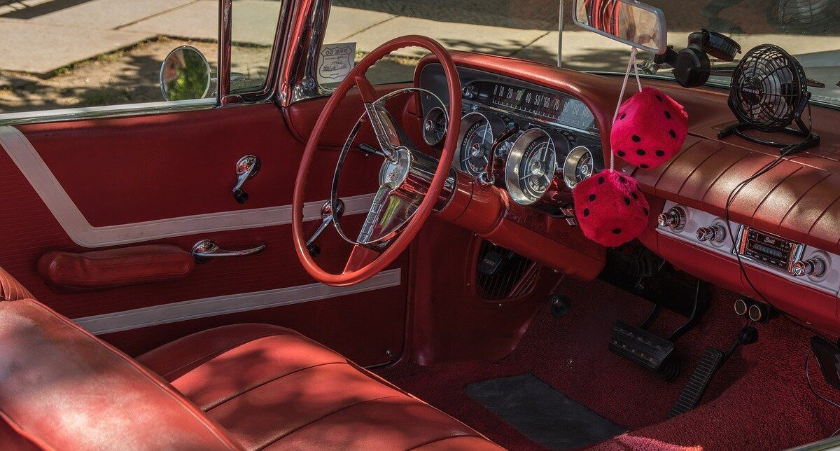 Steering wheel and console of a car with red interior